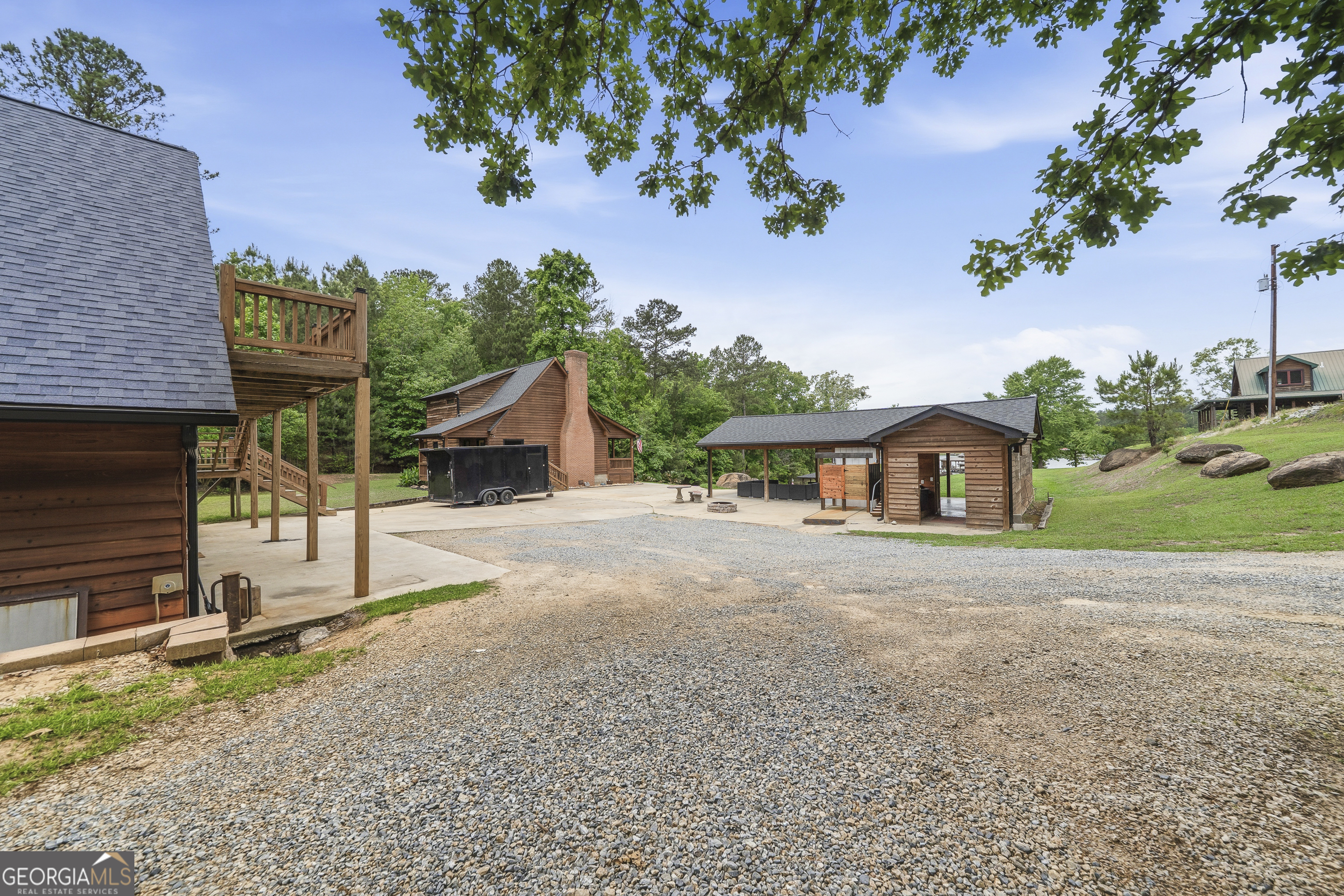 63 Tomahawk Drive Sparta, GA 31087 - Photo 51 of 60 a front view of a house with a yard and garage