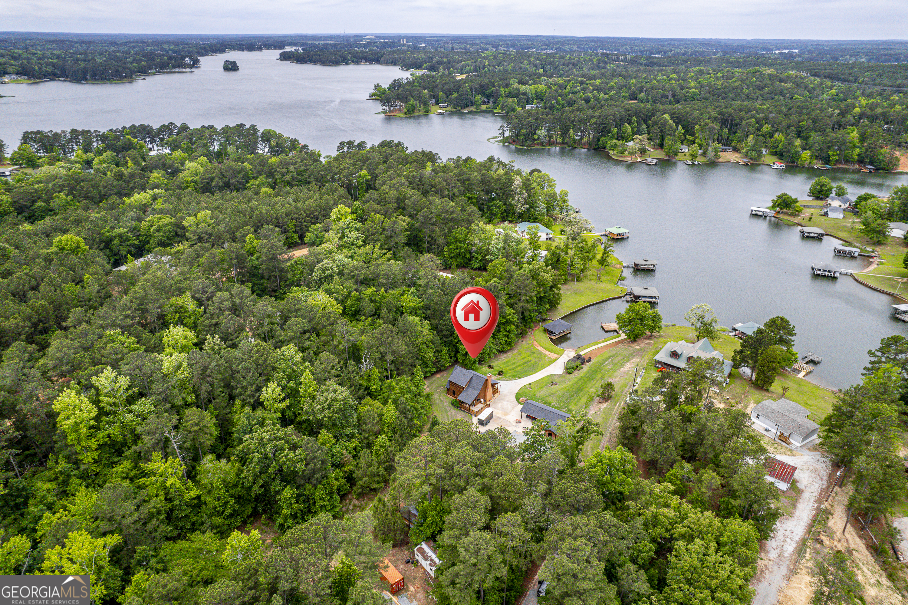 63 Tomahawk Drive Sparta, GA 31087 - Photo 6 of 60 an aerial view of house with yard and outdoor seating