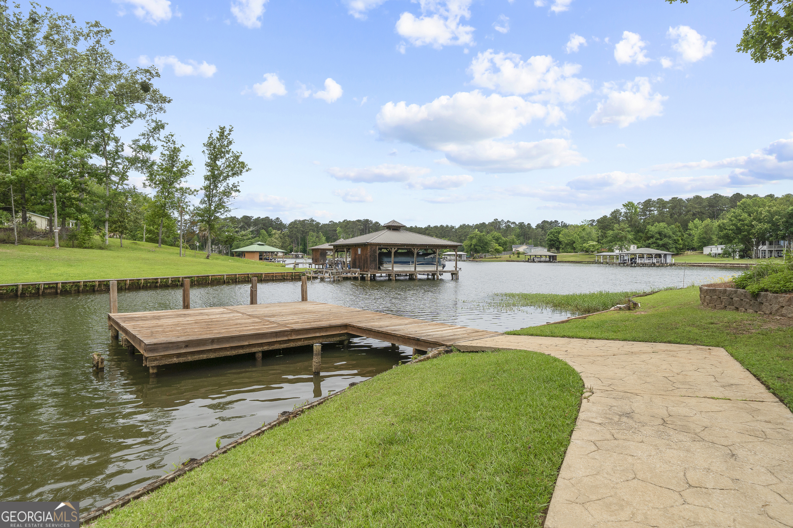 63 Tomahawk Drive Sparta, GA 31087 - Photo 7 of 60 a view of a lake with a yard