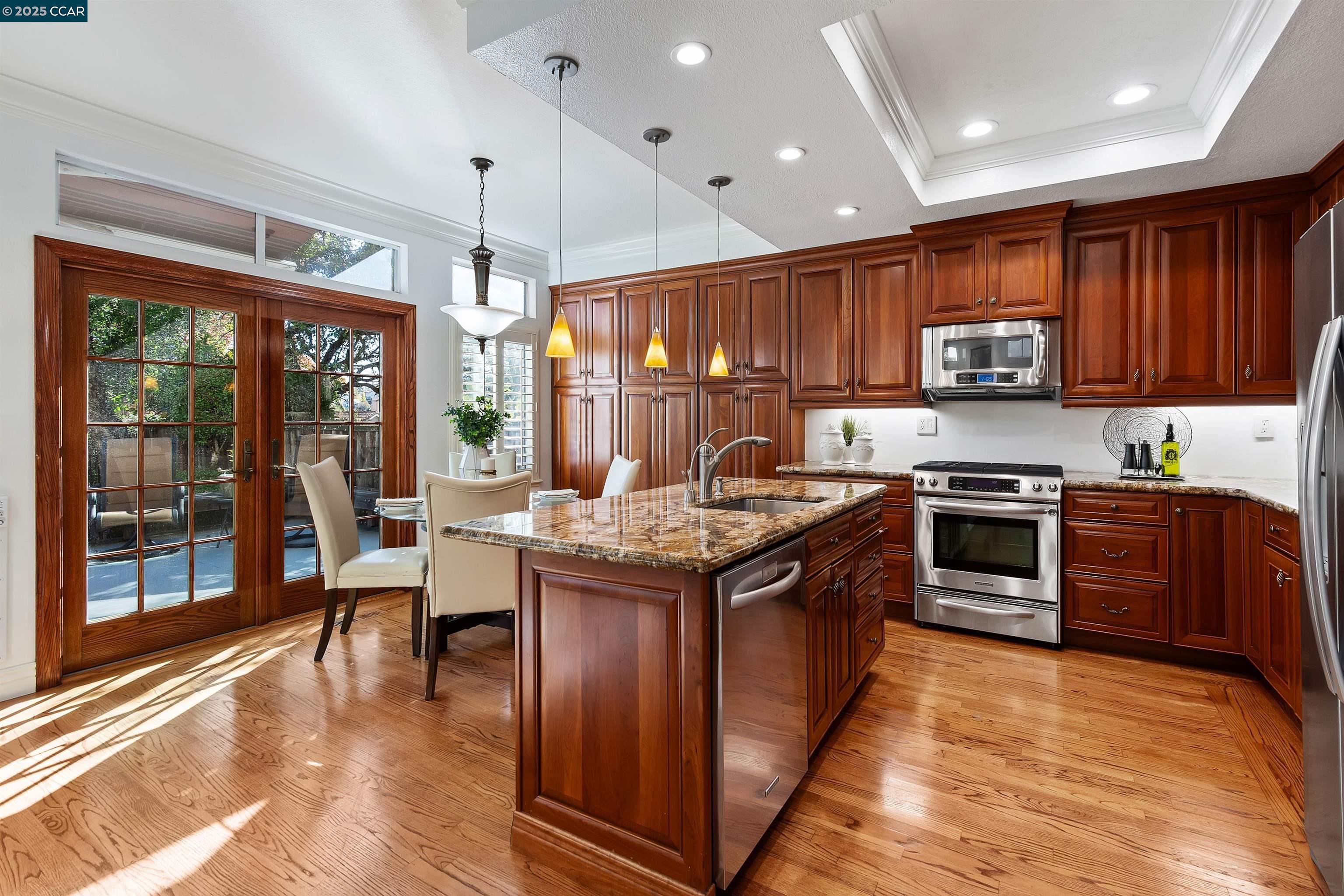 226 Lakeridge Way San Ramon, CA 94582 - Photo 20 of 59 a kitchen with stainless steel appliances granite countertop a stove top oven a sink and a microwave