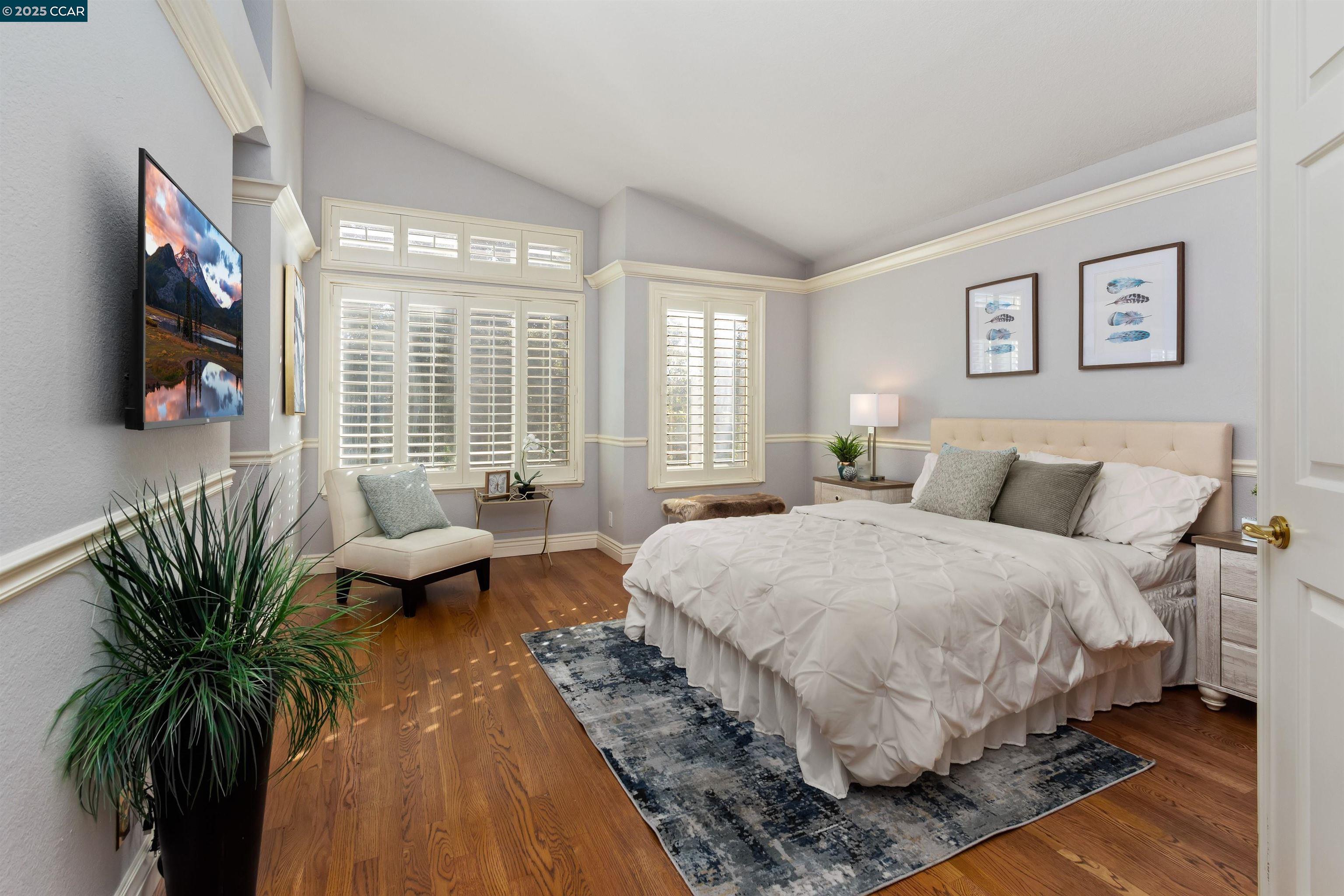 226 Lakeridge Way San Ramon, CA 94582 - Photo 28 of 59 a spacious bedroom with a bed and a flat screen tv