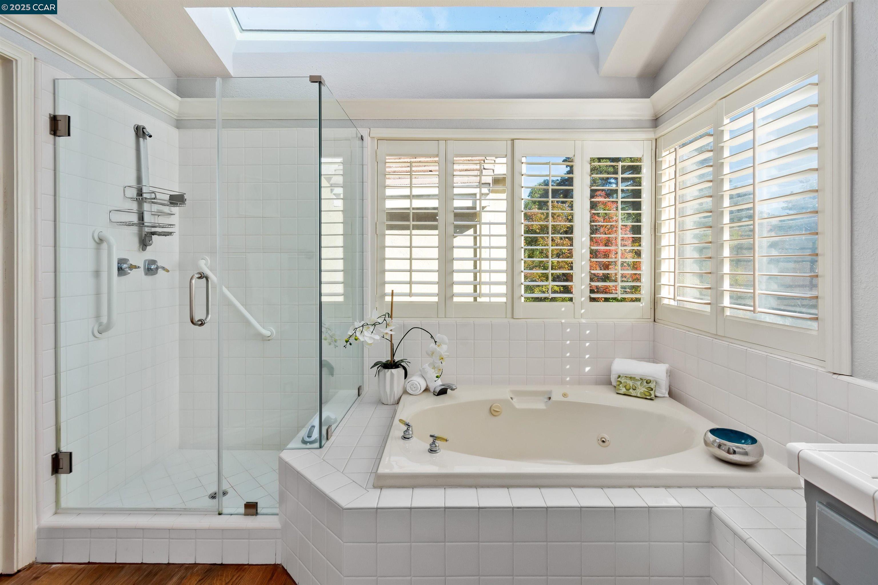226 Lakeridge Way San Ramon, CA 94582 - Photo 30 of 59 a bathroom with a tub a window and a shower