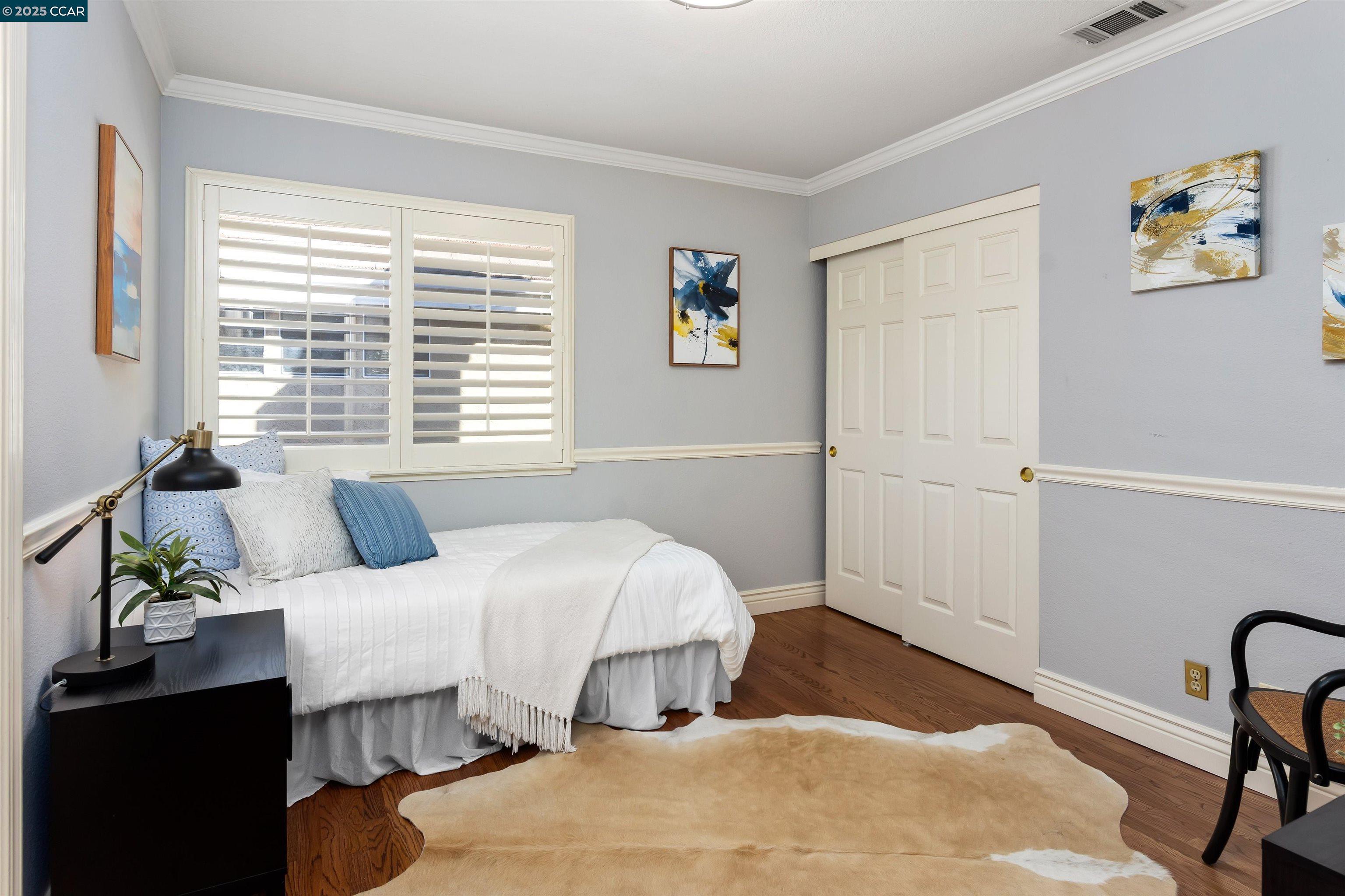 226 Lakeridge Way San Ramon, CA 94582 - Photo 33 of 59 a bedroom with a bed and a table with chair