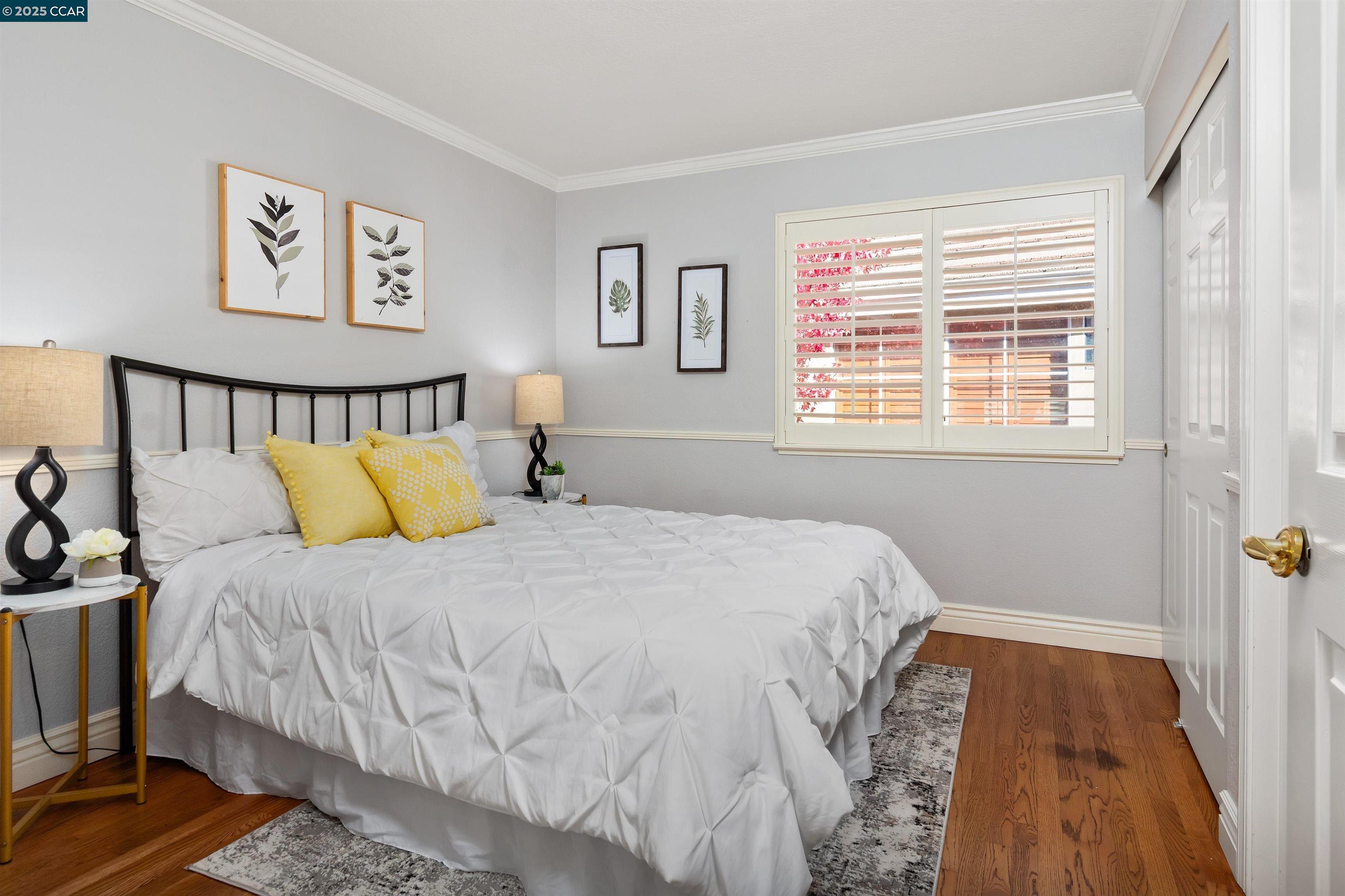 226 Lakeridge Way San Ramon, CA 94582 - Photo 34 of 59 a bedroom with a bed and a painting on the wall