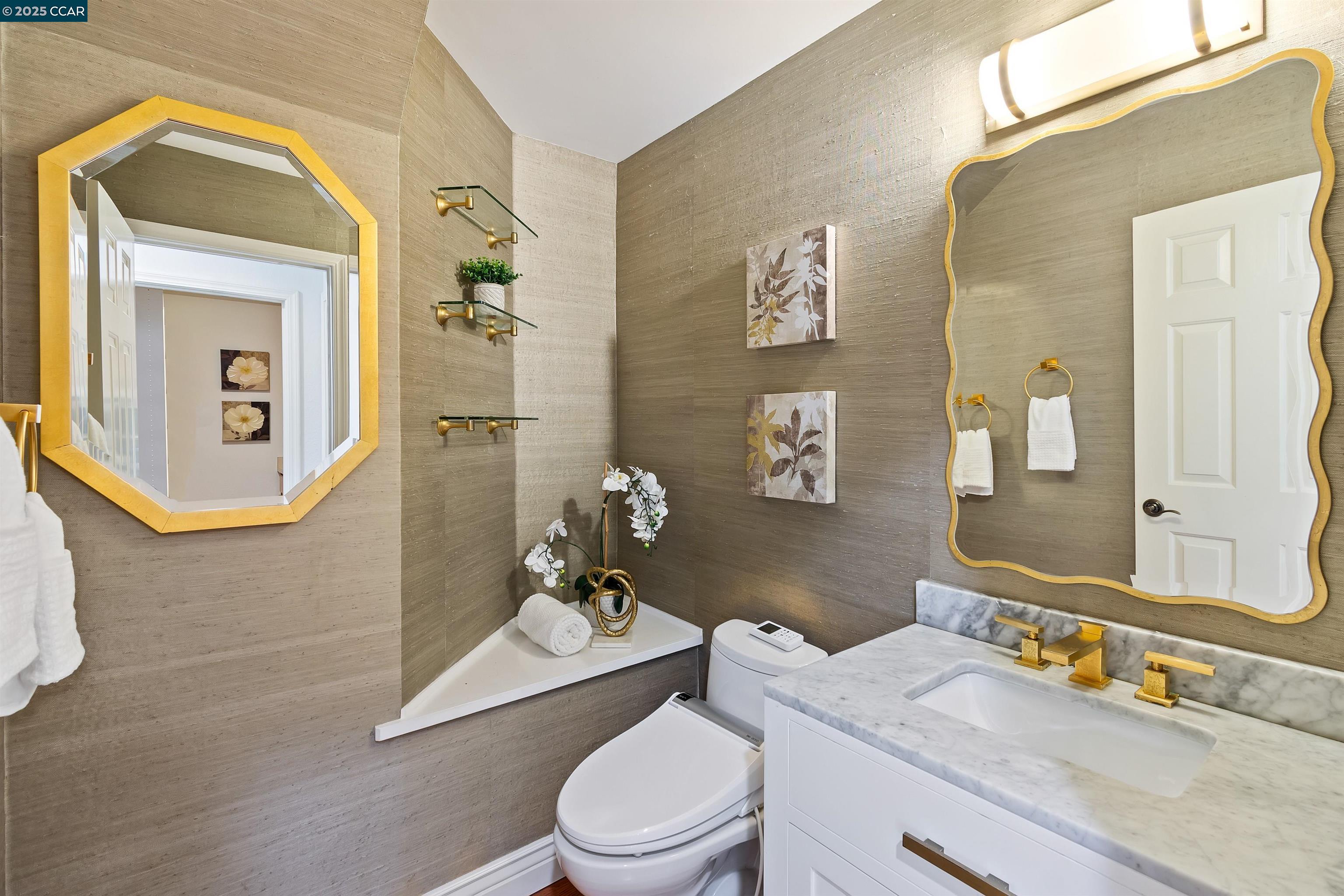 226 Lakeridge Way San Ramon, CA 94582 - Photo 37 of 59 a bathroom with a granite countertop toilet a sink and mirror