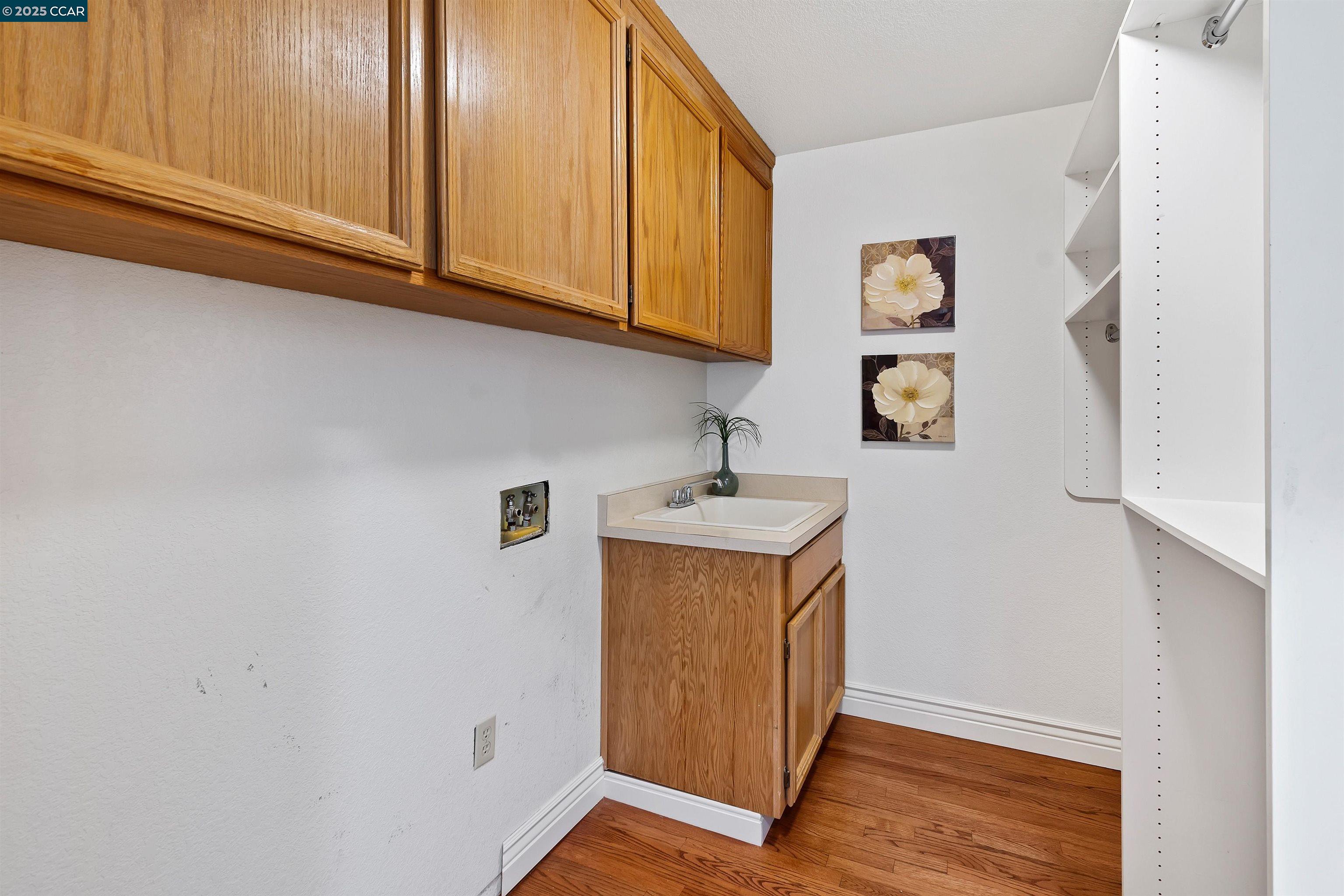226 Lakeridge Way San Ramon, CA 94582 - Photo 38 of 59 a utility room with wooden floor washer and dryer