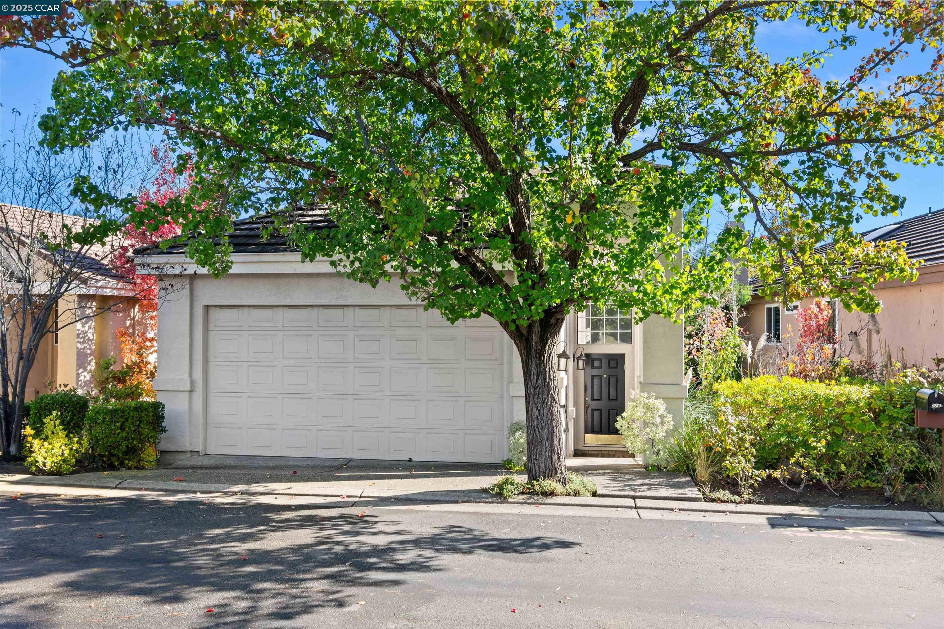 226 Lakeridge Way San Ramon, CA 94582 - Photo 4 of 59 a front view of a house with a yard and garage