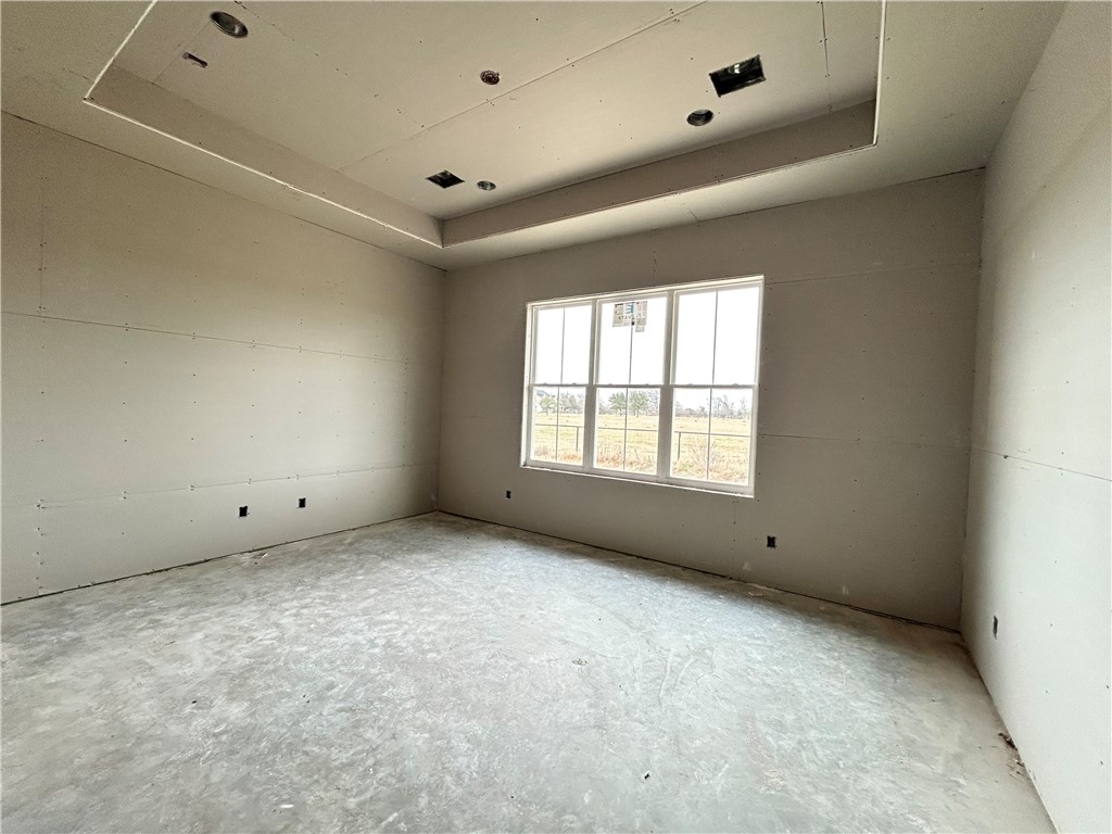 7028 Skipping Rock Path Bryan, TX 77808 - Photo 14 of 18 a view of an empty room with a window