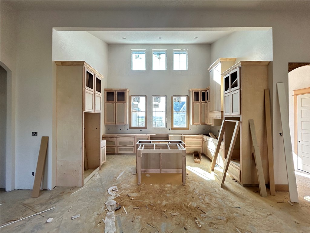 7028 Skipping Rock Path Bryan, TX 77808 - Photo 2 of 18 a living room with furniture a flat screen tv and a large window