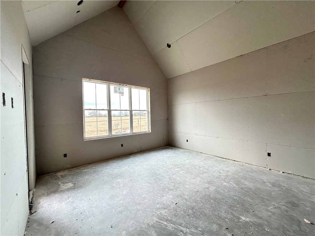 7028 Skipping Rock Path Bryan, TX 77808 - Photo 5 of 18 a view of an empty room with a window