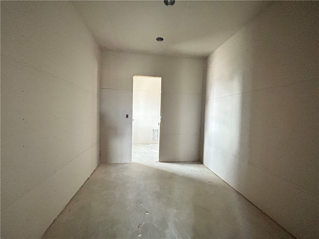 7028 Skipping Rock Path Bryan, TX 77808 - Photo 8 of 18 a view of a livingroom with an empty space