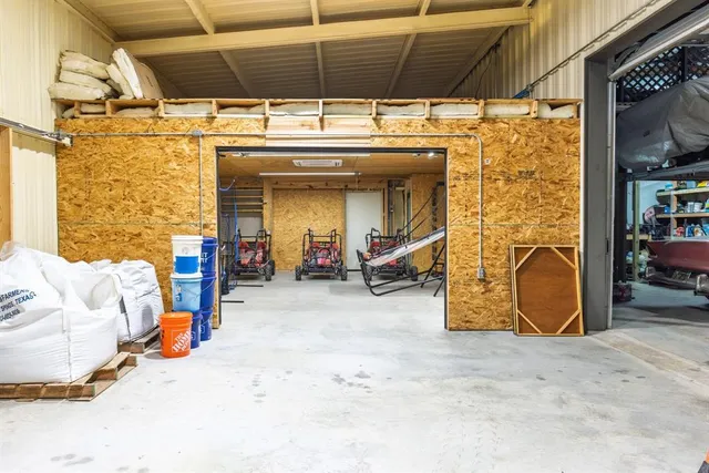 a view of a garage with parked cars
