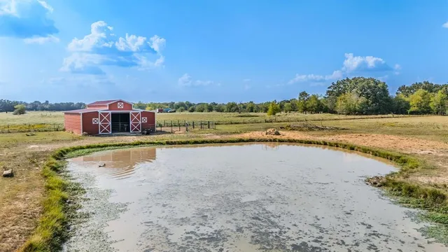 a view of a backyard of the house
