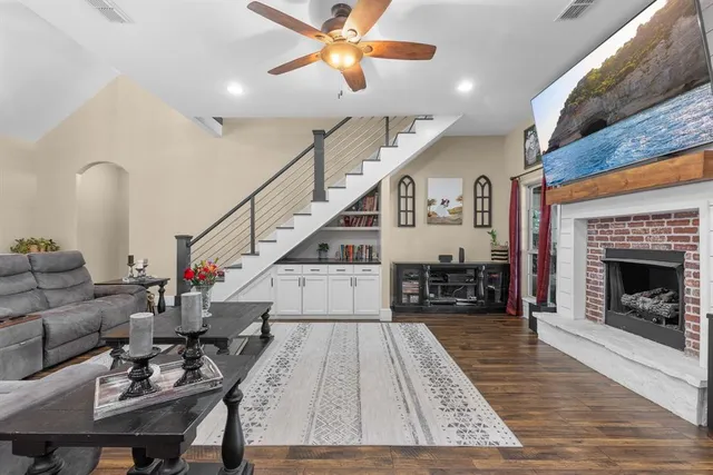 a living room with furniture and a fireplace