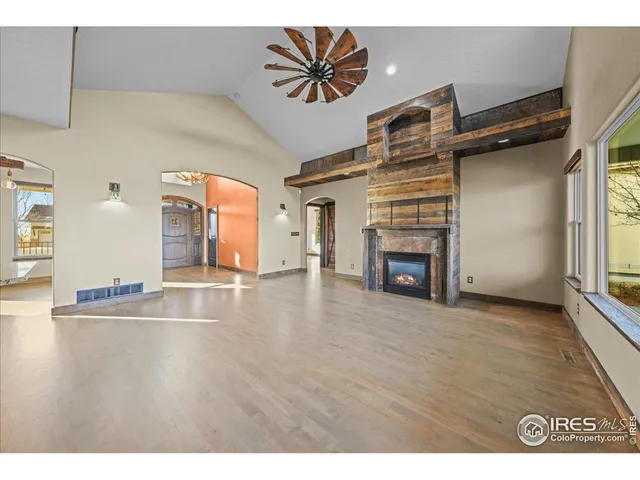 a view of livingroom and a fireplace with wooden floor