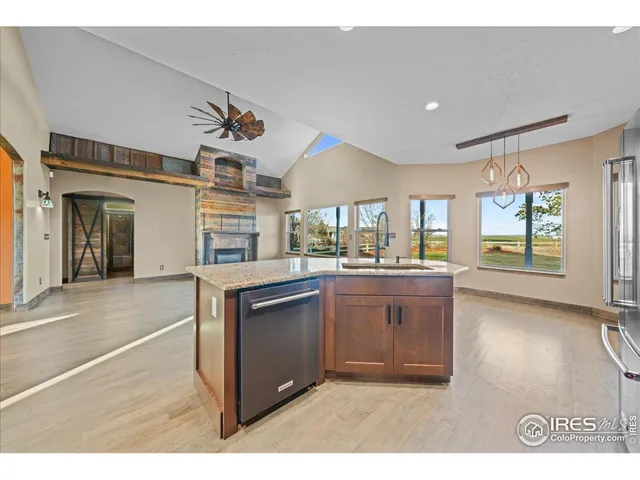 a kitchen with sink and cabinets