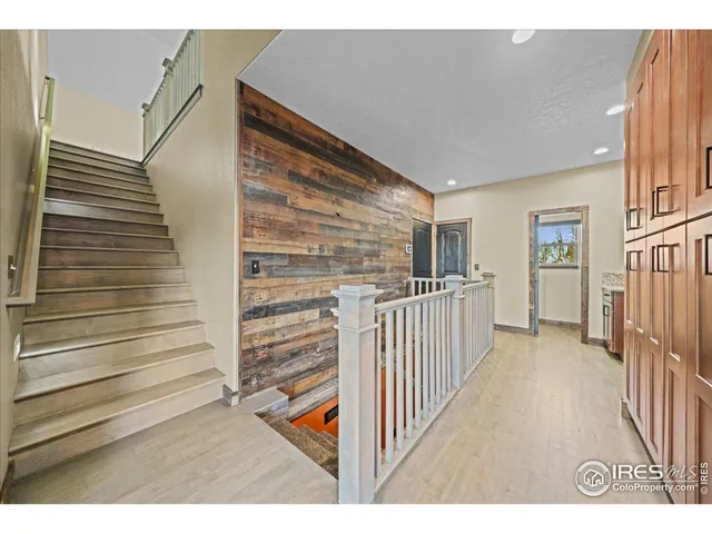 a view of a hallway with stairs
