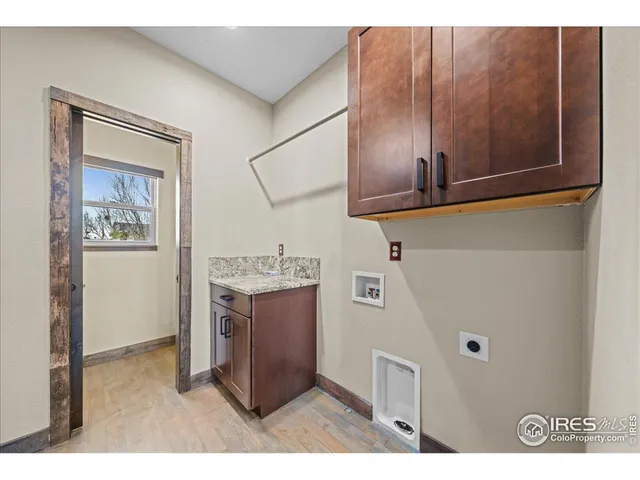 a kitchen with cabinets and window