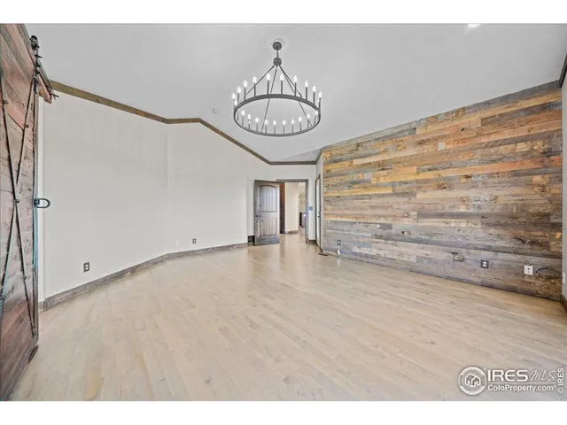 a view of a room with rack and wooden floor