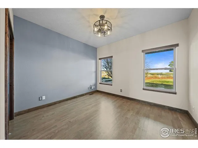 a view of an empty room and a window