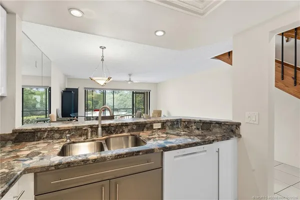 a kitchen with a sink and a window