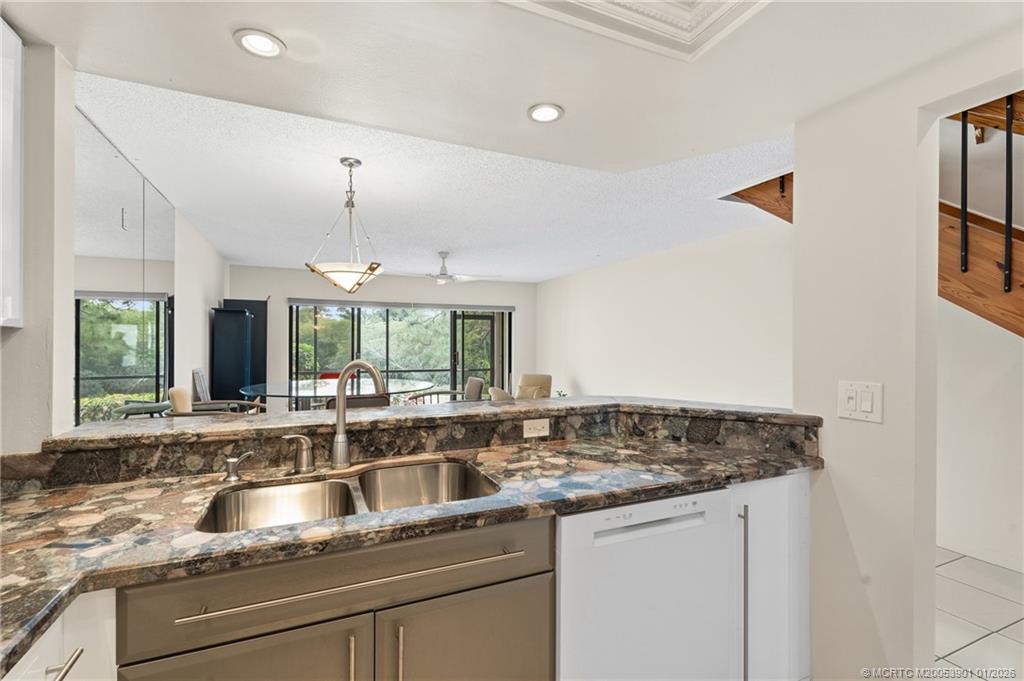 4761 Southeast Binnacle Way, Unit 108 Stuart, FL 34997 - Photo 11 of 25 a kitchen with a sink and a window