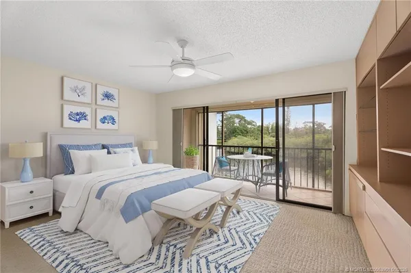 a bedroom with a large bed and a large window