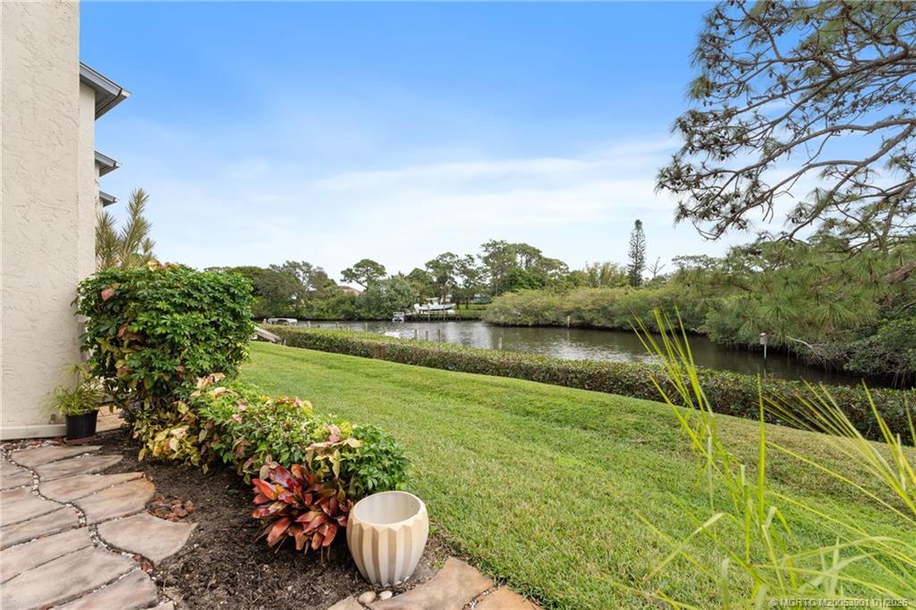 4761 Southeast Binnacle Way, Unit 108 Stuart, FL 34997 - Photo 22 of 25 a view of a lake from a balcony