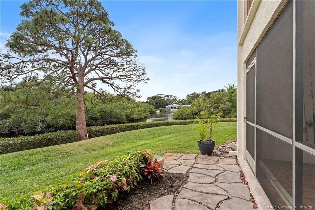 4761 Southeast Binnacle Way, Unit 108 Stuart, FL 34997 - Photo 24 of 25 a view of a patio with a yard