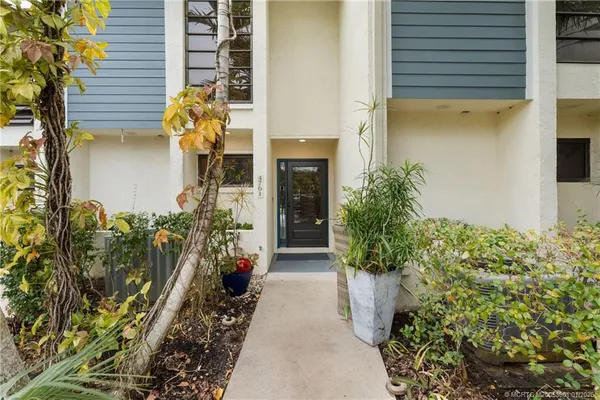 a entryway with flower pots