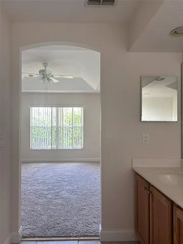 a bathroom with a sink a vanity and a mirror