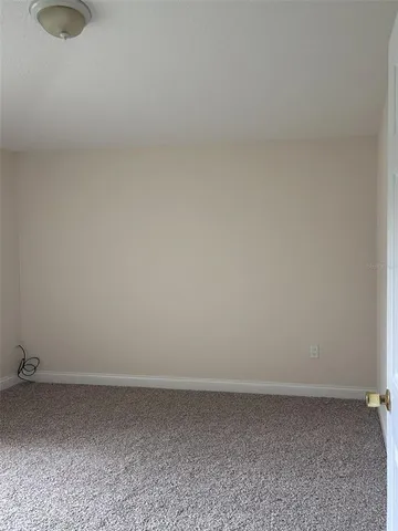 a view of a bathroom from a hallway