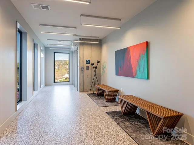 a view of a hallway with workspace