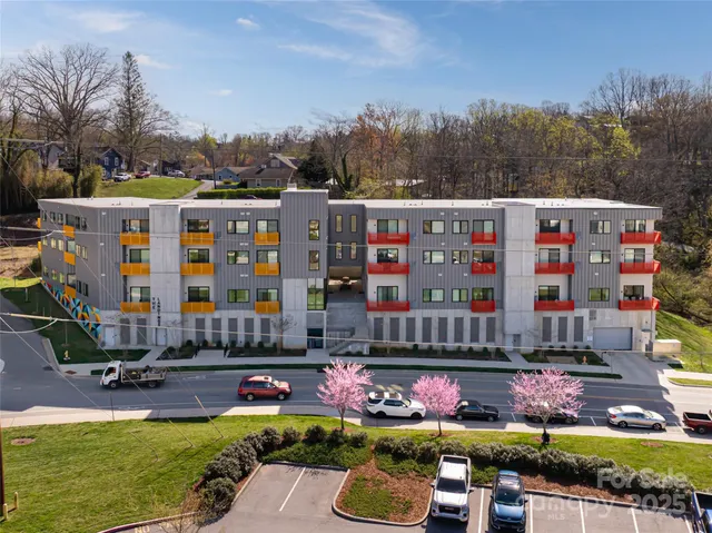 a view of swimming pool is middle in the garden