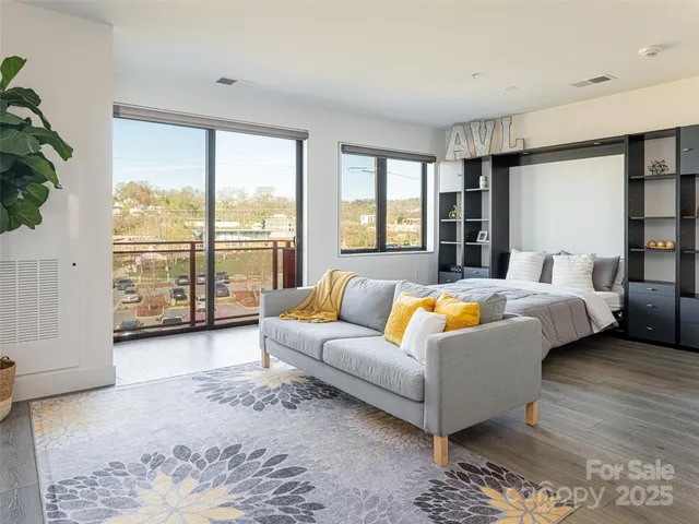 a spacious bedroom with a bed and a couch