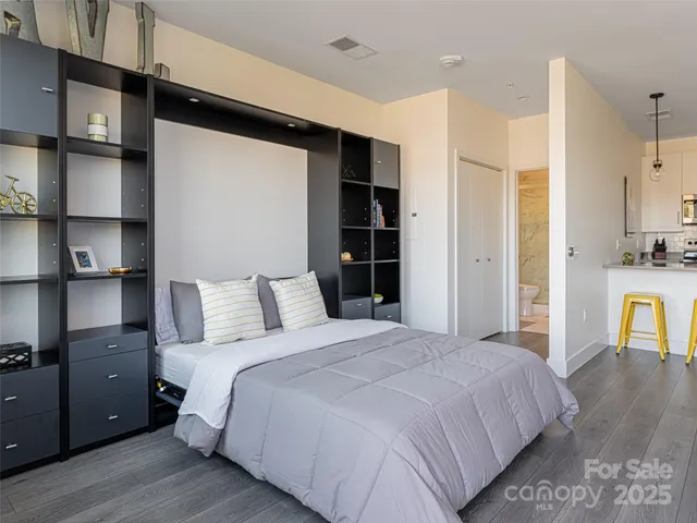 a bedroom with a bed and a cabinets