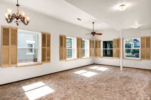 299 West Center Street, Unit 2 Logan, UT 84321 - Photo 14 of 46 Spacious room with multiple windows featuring wood-tone plantation shutters