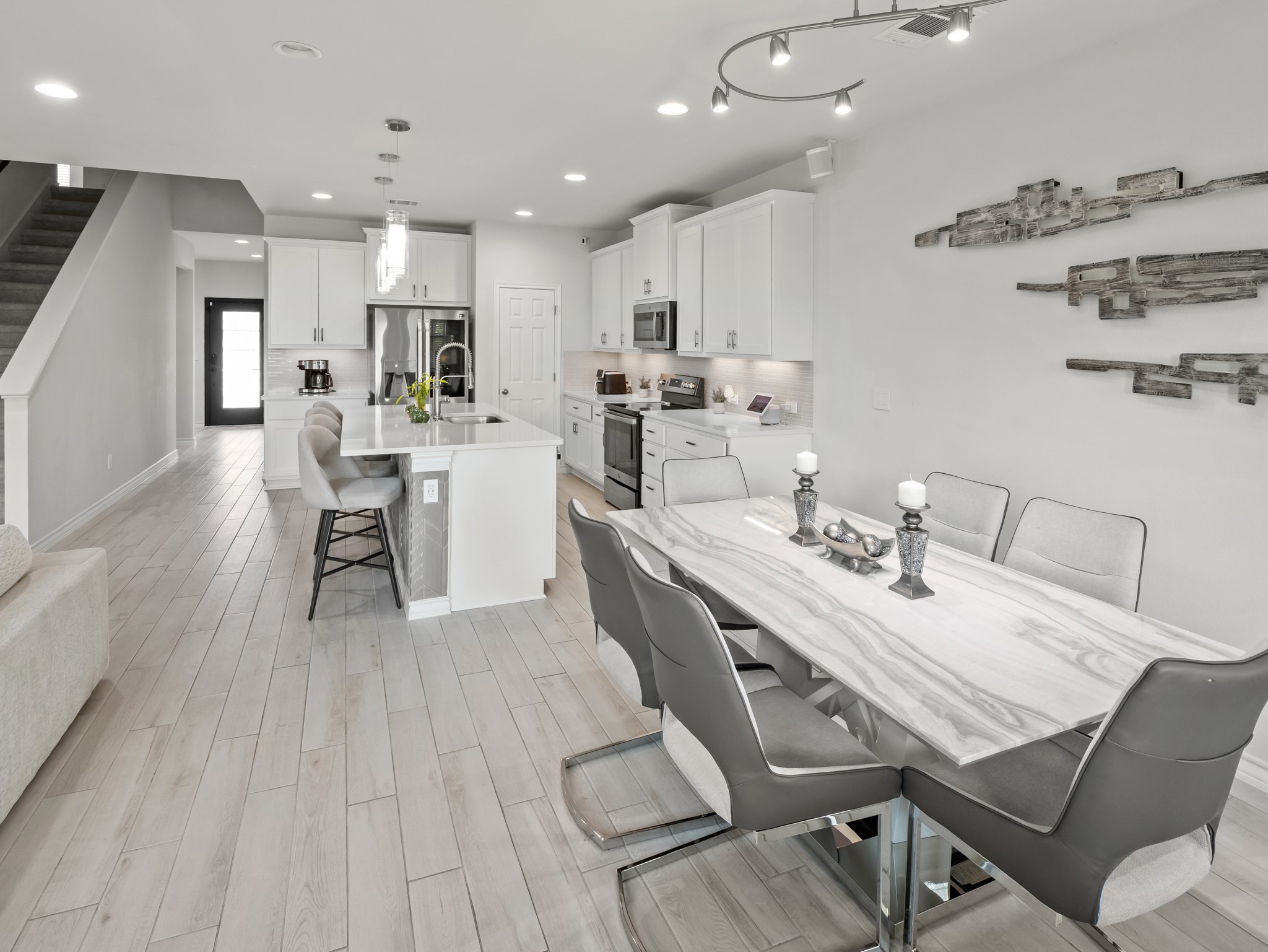 353 Capstone Road Liberty Hill, TX 78642 - Photo 28 of 28 An open floorplan seamlessly connects the well-appointed kitchen to the dining area.