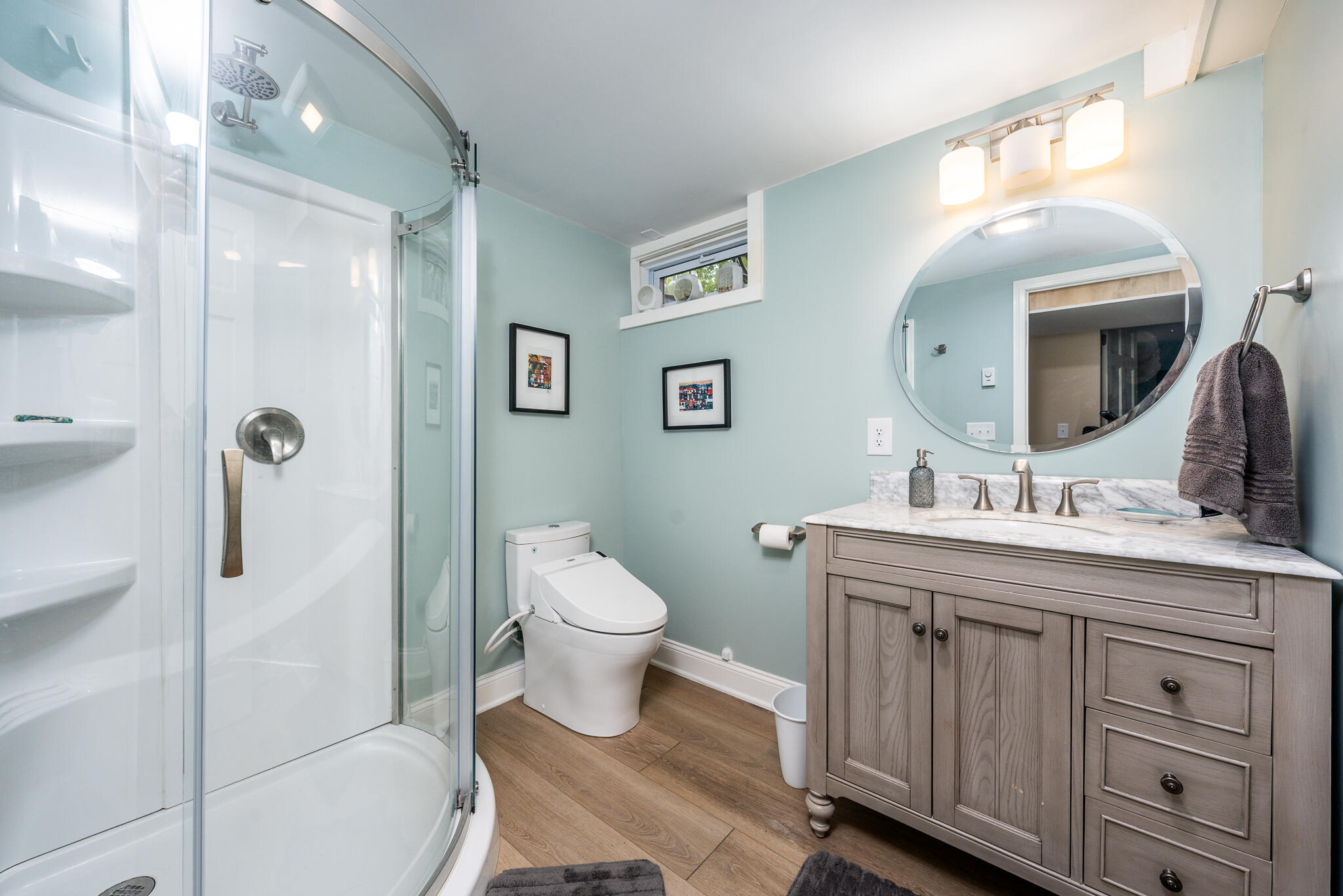 61 Angus Way Centerville, MA 02632 - Photo 39 of 59 a spacious bathroom with a toilet sink and mirror