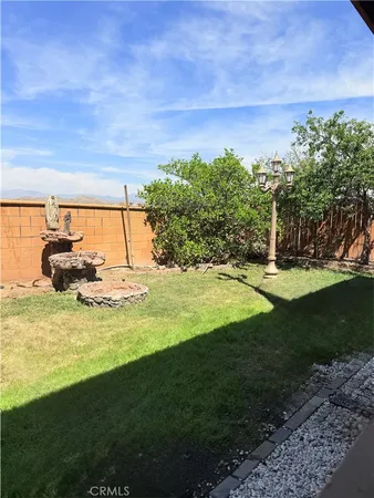 a view of yard with swimming pool