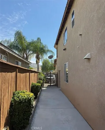 a view of a house with a flower garden
