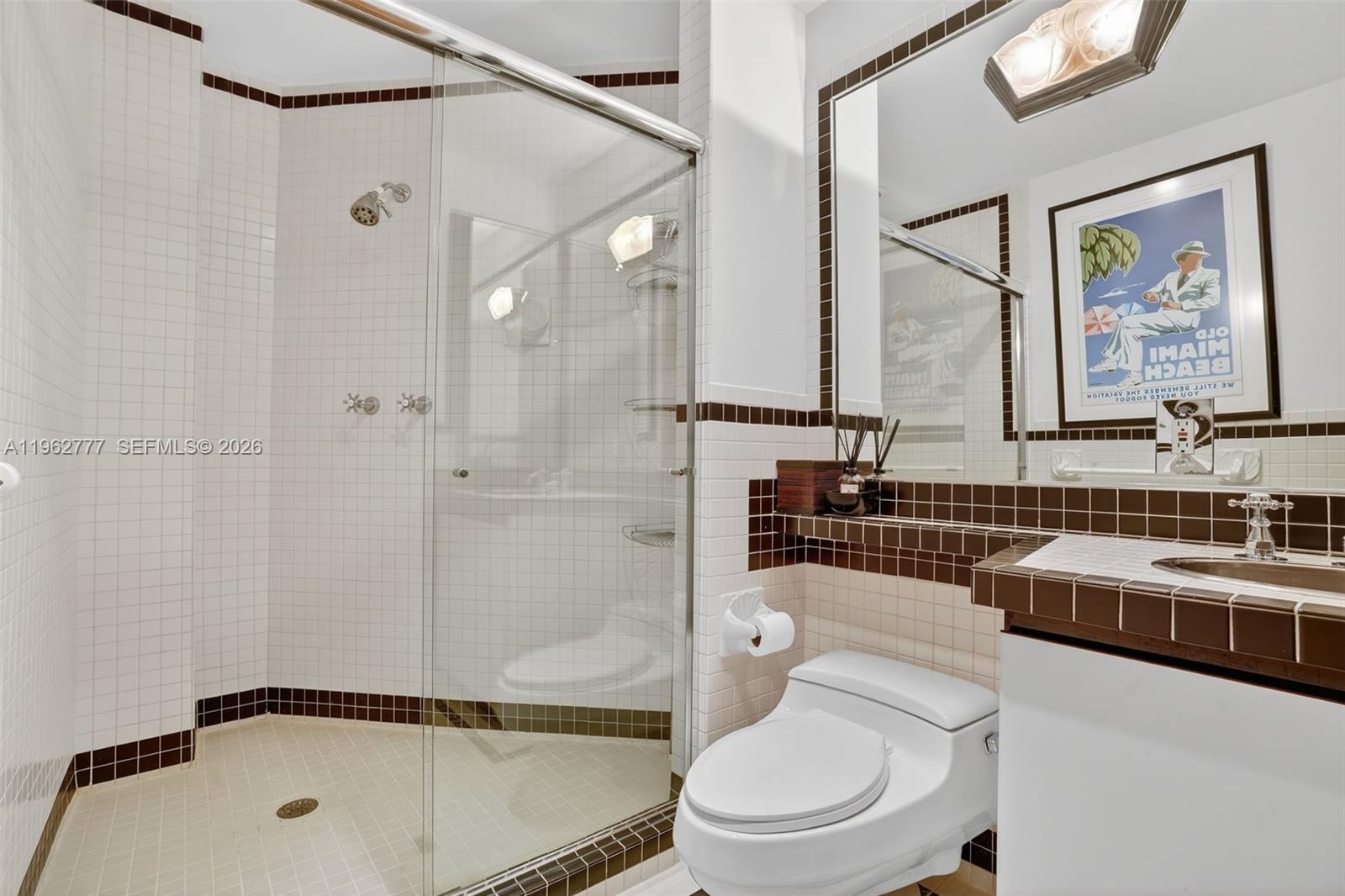 1330 Ocean Drive, Unit R7C Miami Beach, FL 33139 - Photo 17 of 21 a bathroom with a sink a toilet and shower