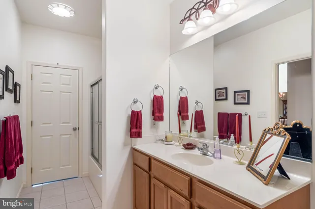 a view of walk in closet with clothes