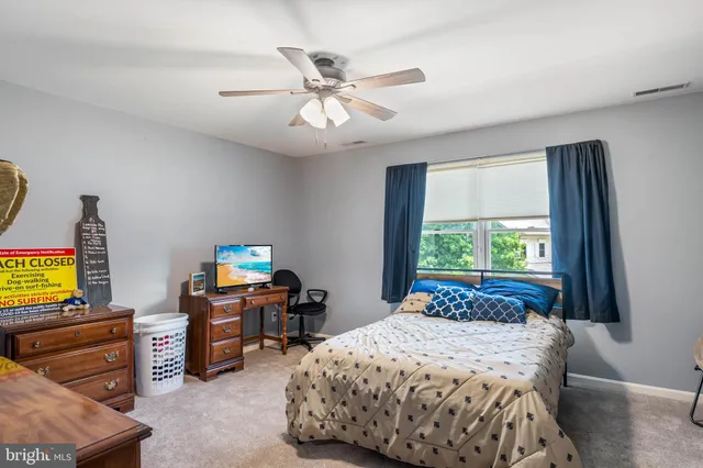 a bedroom with a bed and furniture