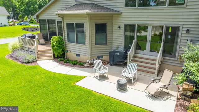 a house view with a sitting space and garden