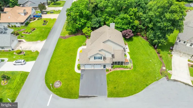 a view of a swimming pool with a yard