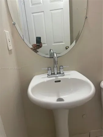 a view of a house with a yard and tree s