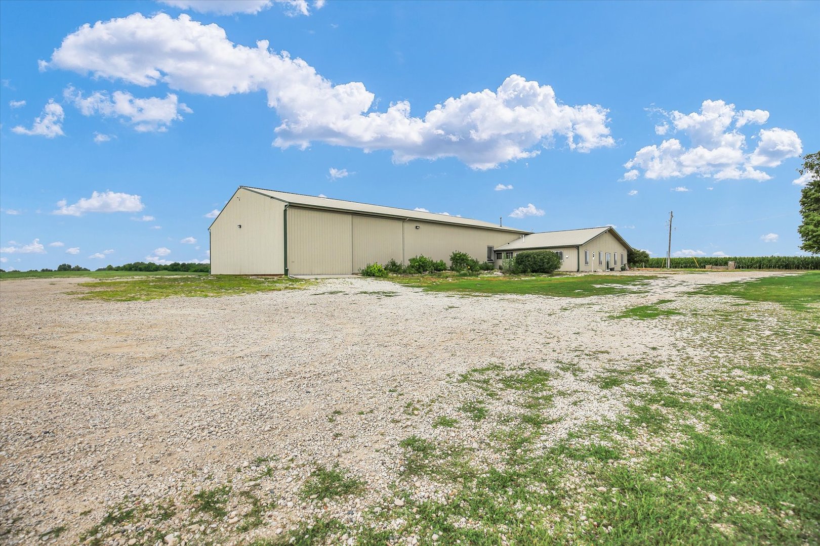 1069 County Road 900 East Champaign, IL 61822 - Photo 11 of 16 a view of a big yard next to a building