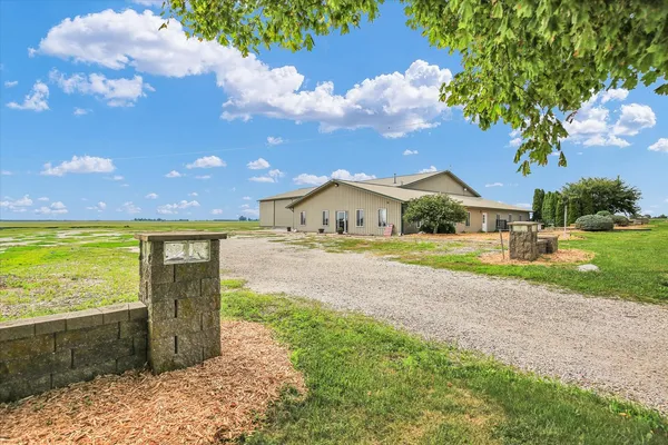 a house view with swimming pool and sitting space