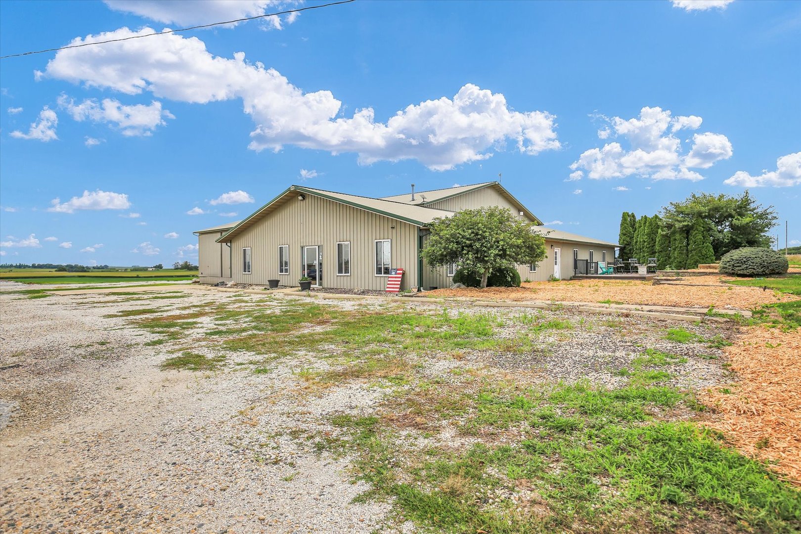 1069 County Road 900 East Champaign, IL 61822 - Photo 2 of 16 a view of a house with backyard and garden